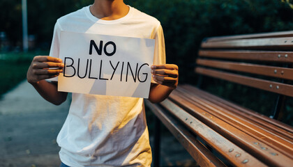 Young Activist Holds No Bullying Sign Promoting Respect.