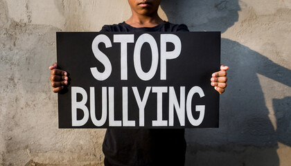 Young Person Holds Stop Bullying Sign Advocating Anti Bullying Message.