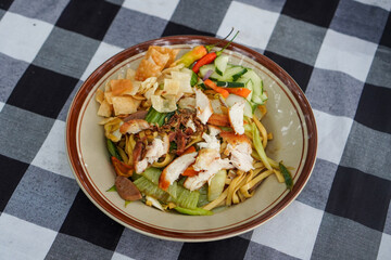 Chicken fried noodles with savory seasoning, tender noodles, mixed vegetables, and comforting street-food flavor, appetizing Asian dish with vibrant colors and clean rustic presentation