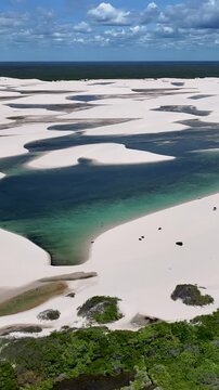 Lencois Maranhenses Skyline In Santo Amaro Maranhao Brazil. Unique Landscape Of White Sand Dunes And Crystal-Clear Lagoons. Coast Sky Seaside Summertime. Seaside Beach Panning Wide.