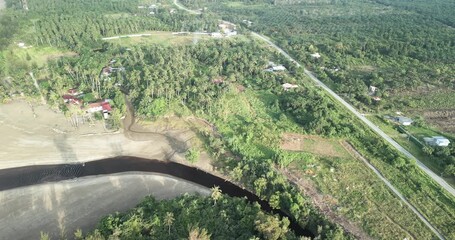 The road between the Rambungan Ferry and Sempadi is peaceful, scenic coastal secondary forests ,Mount Serapi,palm oil estates,Sempadi Beaches and Prawn Farm.