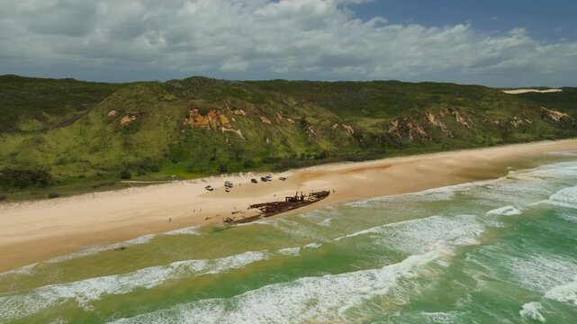 Aerial Drone Flyover Maheno Shipwreck Landmark On Sandy Fraser Island Beach, 4K Australia