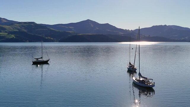Aerial View of Yachts Anchored in Calm Harbor at Sunset