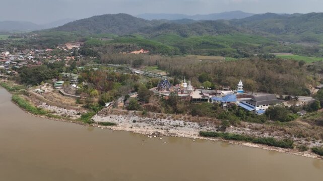 Aerial view of Wat Phrathat Hua Kwan temple the beautiful local temple situated nearly Mekong river in Chiang Saen district in Chiang Rai province, Thailand.