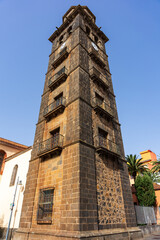 Bell tower of Nuestra Senora de La Concepcion church, historic stone architecture in La Laguna, San Cristobal de La Laguna, Tenerife.