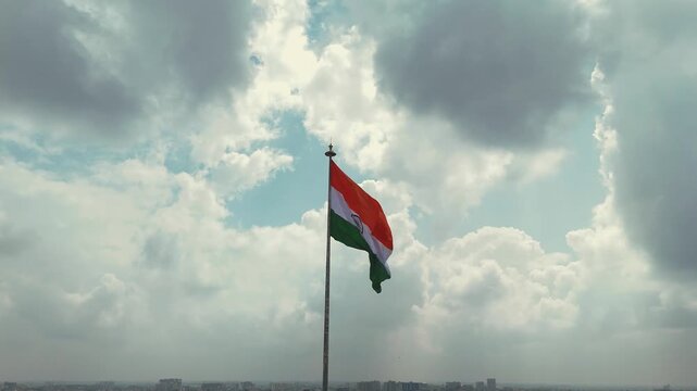 Indian Flag Against Blue Sky, Tricolor Waving in Cloudy Sky, National Flag Freedom Concept, Patriotic Indian Flag Outdoors, Tiranga Flying High Stock Video.