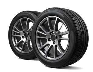 Obraz premium Two car tires with alloy wheels angled towards the viewer, showcasing tread patterns on a clean white background