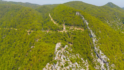 Cakallar, Alanya, Turkey. Drone footage of ancient Alara Castle fortress remains on mountain summit with river view. Aerial View