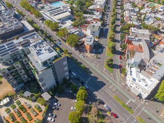 Aerial view of highrise buildings along tree lined streets of an inner city suburb