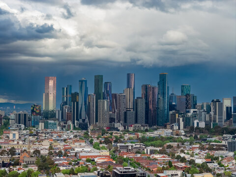 Dark storm clouds and rain over large city skyline Melbourne, Victoria