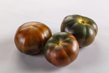 Obraz premium Ripe black juicy tomato cumato