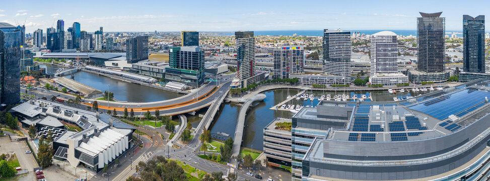 Aerial panorama view of bridges over an inner city river lined with highrise buildings