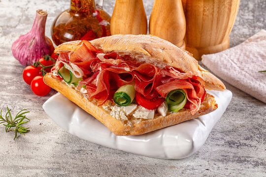 Sandwich with ciabatta and jamon - Powered by Adobe