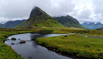 Serene mountain landscape with a winding stream and lush greenery under a cloudy sky.