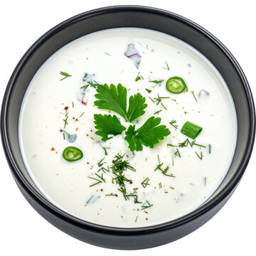 Invigorating chalap, a central asian yogurt soup perfect for summer, served in a dark bowl and isolated on a white background