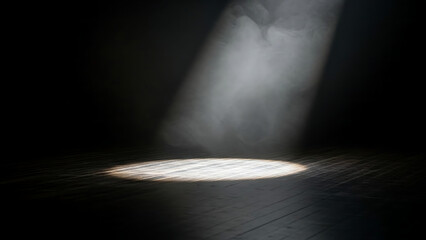A dramatic beam of white light cuts through smoky air, creating a focused circular glow on a dark wooden stage, evoking a sense of mystery and anticipation