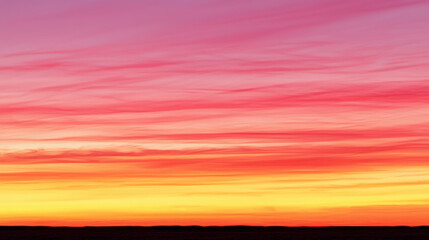 Vibrant Sunset Sky with Gradient Colors and Soft Cloud Patterns