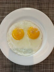 A plate of eggs on a table