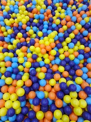 Vibrant Plastic Balls Filling a Playground Ball Pit Area with Colorful Orbs from an Overhead Viewpoint