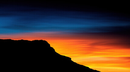 Breathtaking Sunset Over Mountain Silhouette with Vibrant Colors