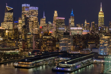New York City, Manhattan skyline. New York City downtown at night. NYC metropolis aerial view. New York City skyline with skyscrapers at night. New York night skyline. NYC aerial cityscape.