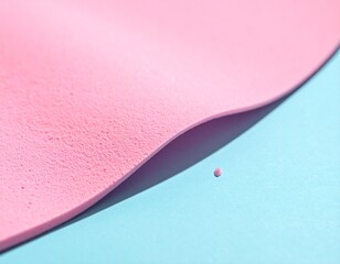 Abstract Pastel Pink Granular Sponge Texture with Wavy Curve on Light Blue Background