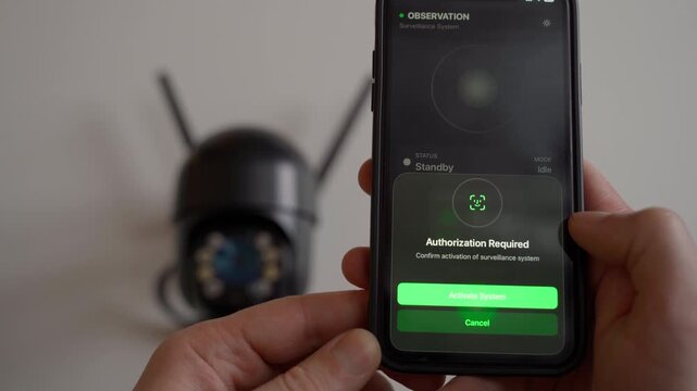 Turning on a surveillance camera via a mobile app, close-up. A fictional app for authentication and connection to the camera