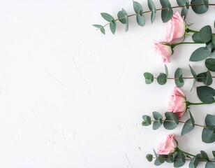 Minimalist Eucalyptus Branches and Pink Roses Flat Lay on White Background with Copy Space