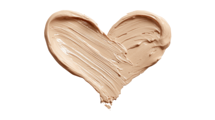 Creamy light beige foundation smear forming a heart shape, showing a thick cosmetic texture isolated on a transparent alpha channel background, symbolizing beauty and self love
