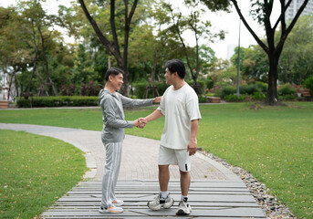Happy meeting Asia mature with Asia young man in the park