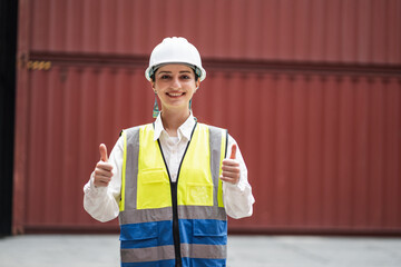 Portrait thump up Caucasian woman logistics workers working with man worker at container site