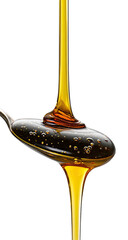 Liquid gold cascading from spoon