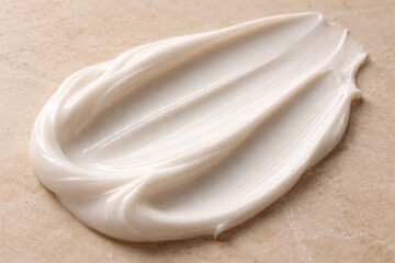 Creamy texture: A macro shot highlights the luxurious swirl of a creamy substance. The elegant display invites the viewer to the realm of self-care.
