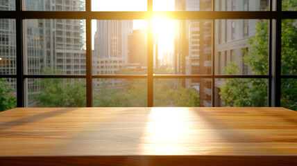 Sunlight shines on wooden table in modern office with large glass windows and city view