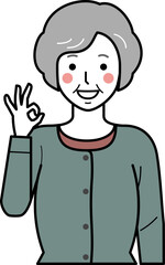 正面向き。OKサインをするカーディガンを着た高齢女性。
