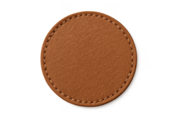 Round brown leather patch with stitching on transparent background