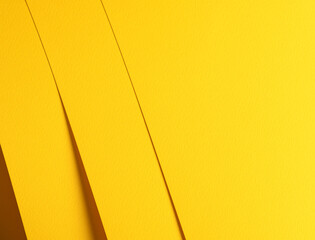 Abstract matte paper composition in a warm yellow tone with layered sheets creating subtle depth and