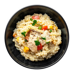 Traditional Italian chicken risotto with a sprinkle of parsley and lemon zest, presented in a bowl, isolated on a plain white background.