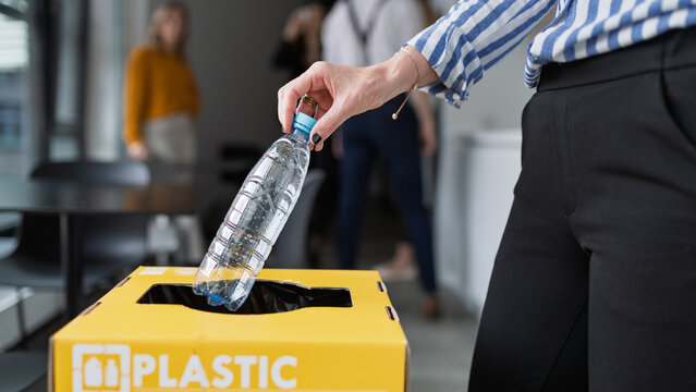 Waste separation and recycling in business office.