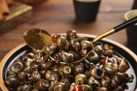 Stir-Fried Snails with Spicy Peppers and Chopsticks