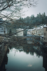 View of Alzette River, from B&eacute;inchen Br&eacute;ck Bridge, Pafendall, Luxembourg, Pfaffenthal. Snow covered scenery. January 2nd, 2026.