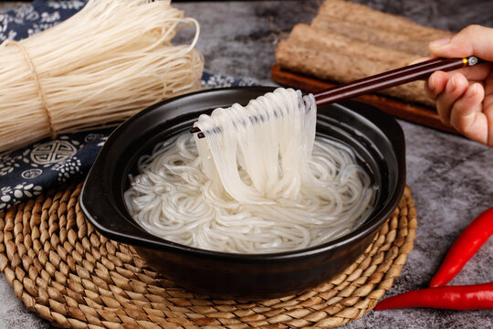 Asian White Noodles in Black Bowl with Chopsticks