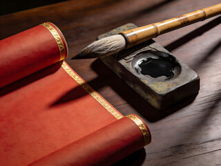 asian calligraphy writing tools with brush inkstone and scroll on wooden desk