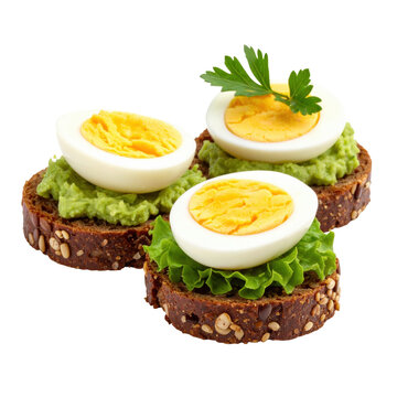 Open-faced egg canap&eacute;s on rye bread isolated on white background, showcasing the bright yellow yolk against the dark bread for a striking image
