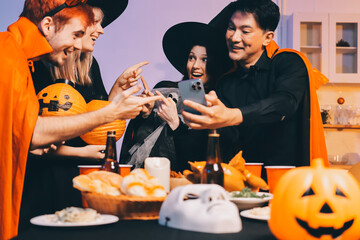 Friends enjoying a Halloween party at a bar making a toast
