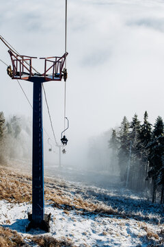 Ski Lift Tower in Foggy Winter Forest
