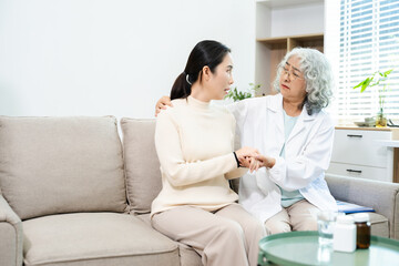 Fototapeta premium Psychiatrist comforting stressed patient during mental health therapy. Psychology counseling, emotional support, depression and anxiety treatment