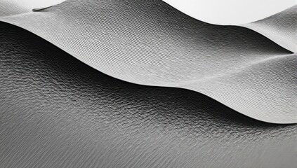 Serene grayscale photo of undulating sand dunes with delicate patterns