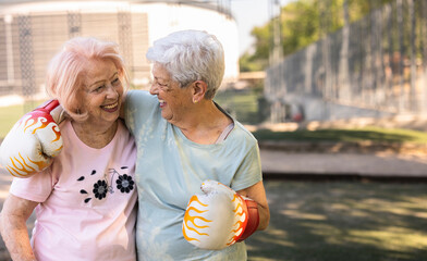 Senior women enjoying boxing training and active aging outdoors