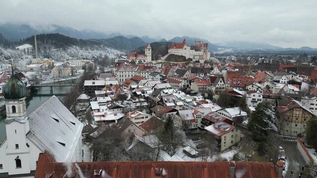 aerial view of the old town of fuessen in bavaria germany winter 4k